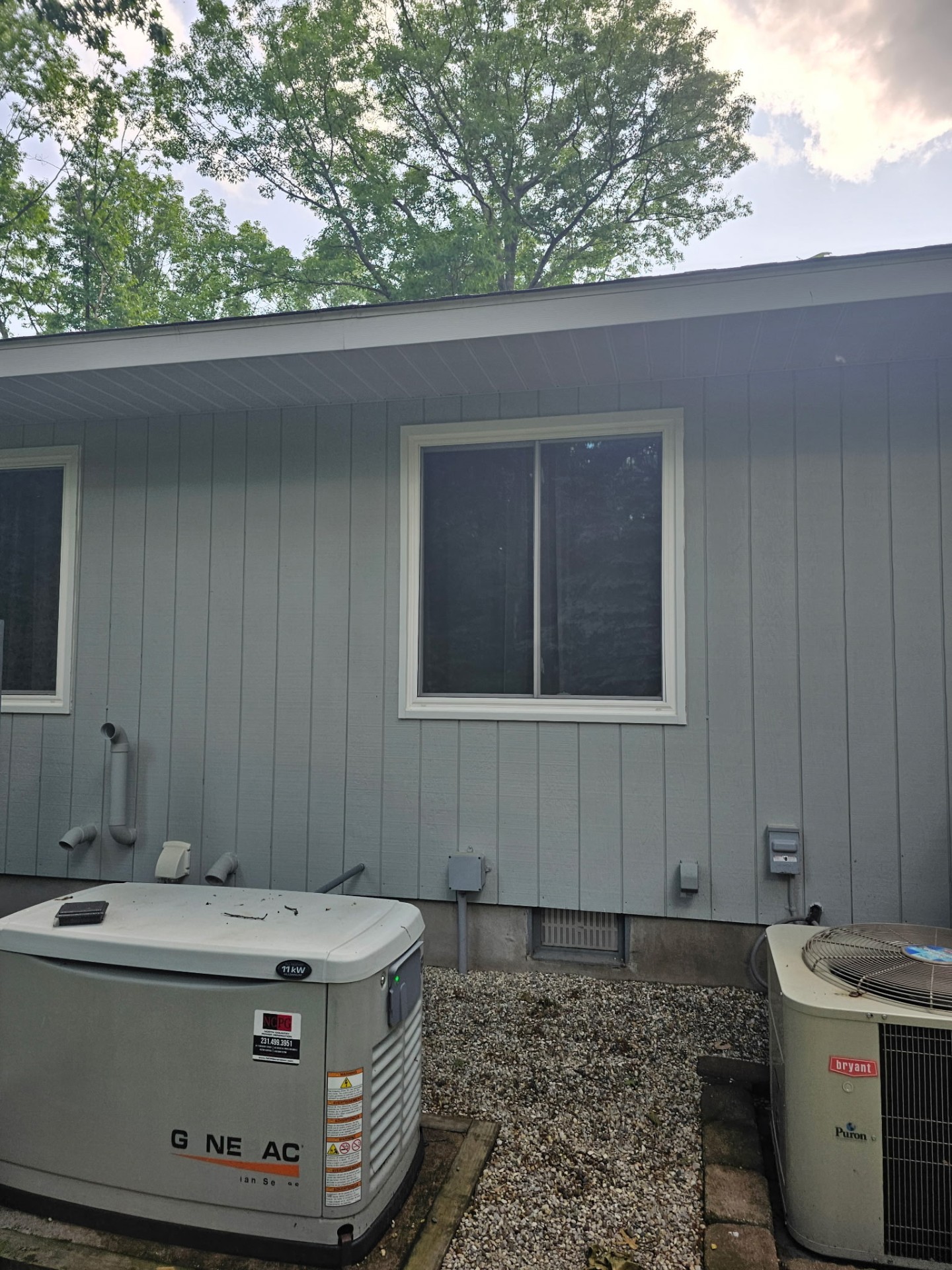 Freshly painted exterior siding in soft gray